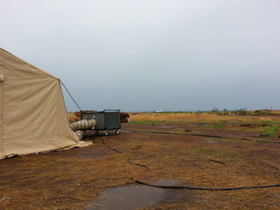 equipment with tent in field