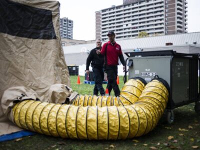 people walk past portable HVAC